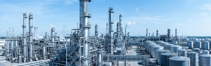 Process manufacturing plant with distillation towers and storage tanks